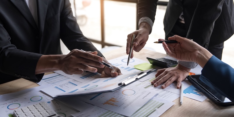 Professionals reviewing information for land due diligence